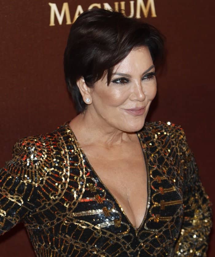 Kris Jenner wearing black and gold Balmain dress