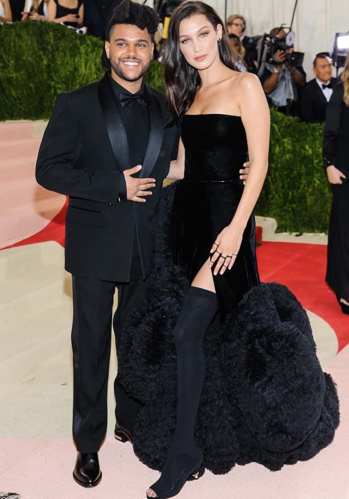 Bella Hadid poses with boyfriend, The Weeknd, on the steps of the Met Gala
