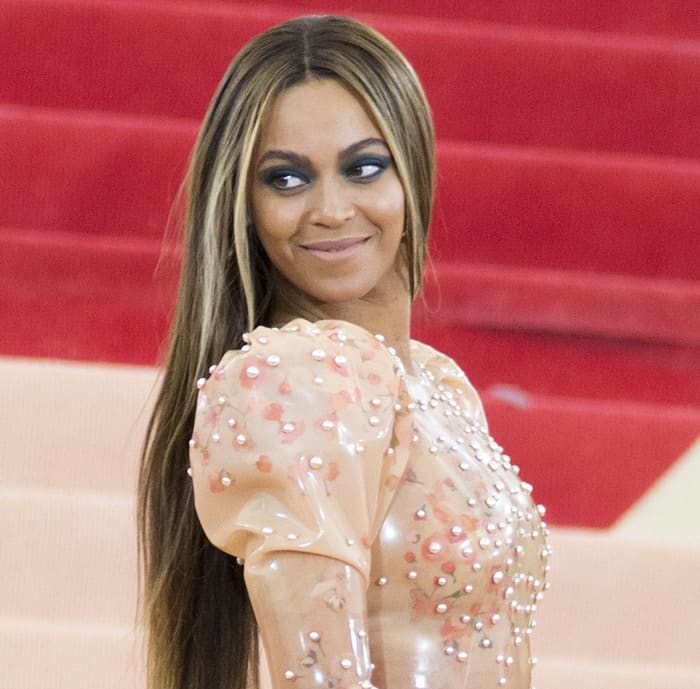Beyoncé radiates confidence in her skintight, pearl-embellished latex Givenchy gown at the 2016 Met Gala