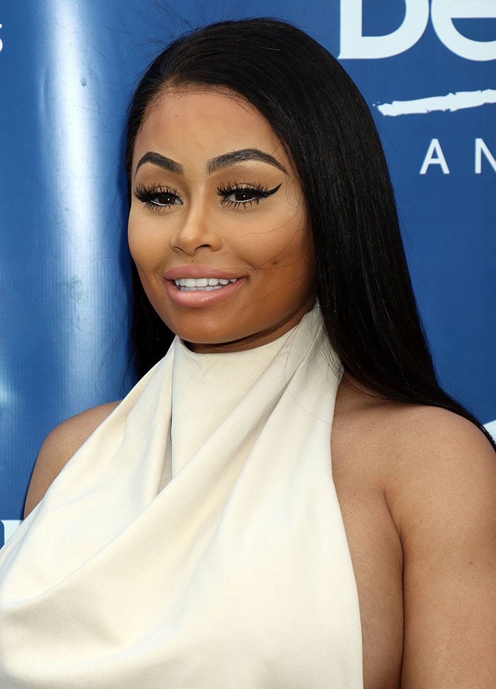 Blac Chyna wore her dark tresses down and straight, and went full glam with bronzed makeup, winged eyeliner, mascara and nude lipstick