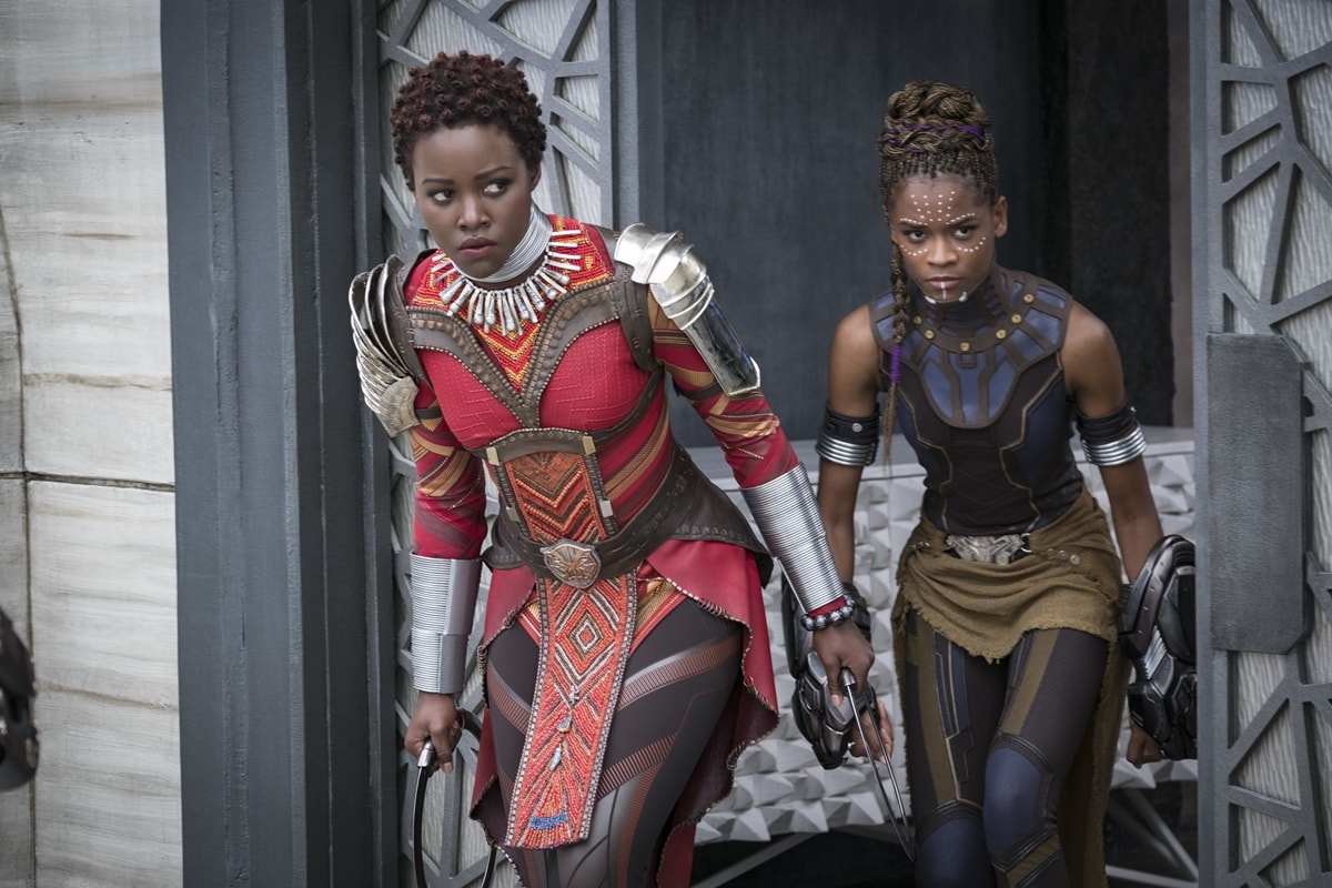 Lupita Nyong'o as Nakia and Letitia Wright as Shuri in the 2018 American superhero film Black Panther