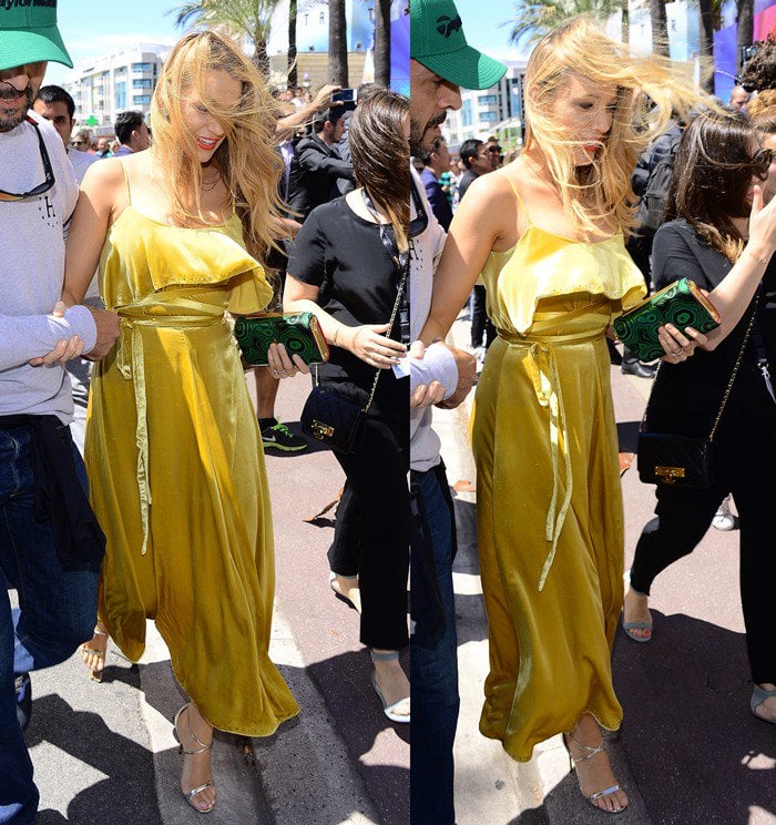 Blake Lively wears a gold Valentino dress while in France for the 2016 Cannes Film Festival