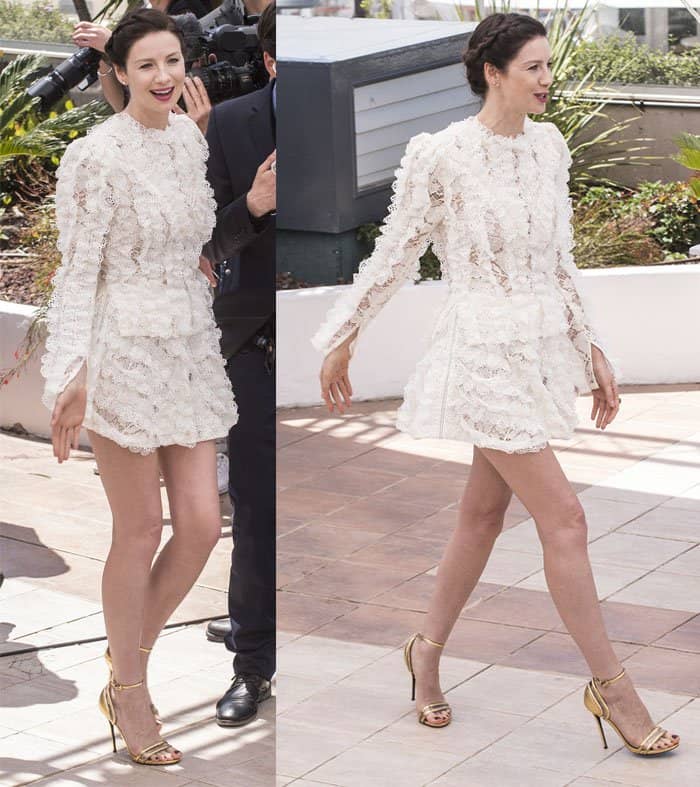 Caitriona Balfe showcases her elegant legs and chic braided hairstyle while donning a Louis Vuitton lace dress at the Cannes Film Festival
