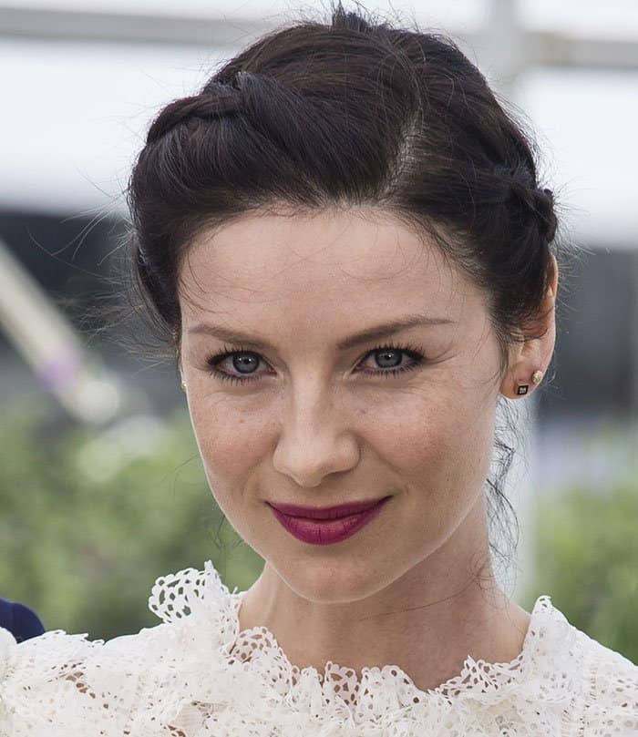 Caitriona Balfe showcases her striking lips, elegant braided hairstyle, and captivating eyes at the Cannes Film Festival on May 12, 2016