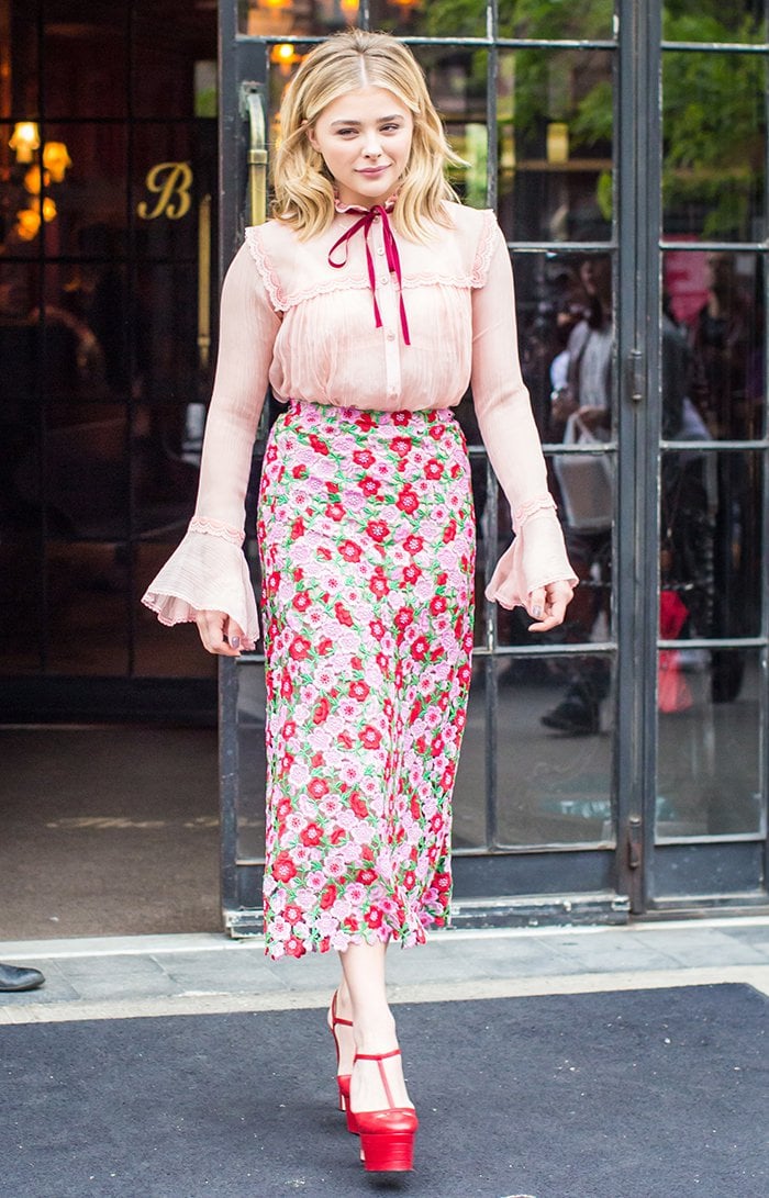 Chloe Grace Moretz wears a pink-and-red floral ensemble from Gucci while out in New York City