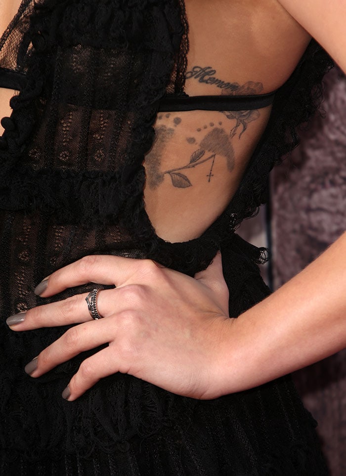 Chloë Grace Moretz shows off her ribcage tattoos in a barely-there Alexander McQueen dress