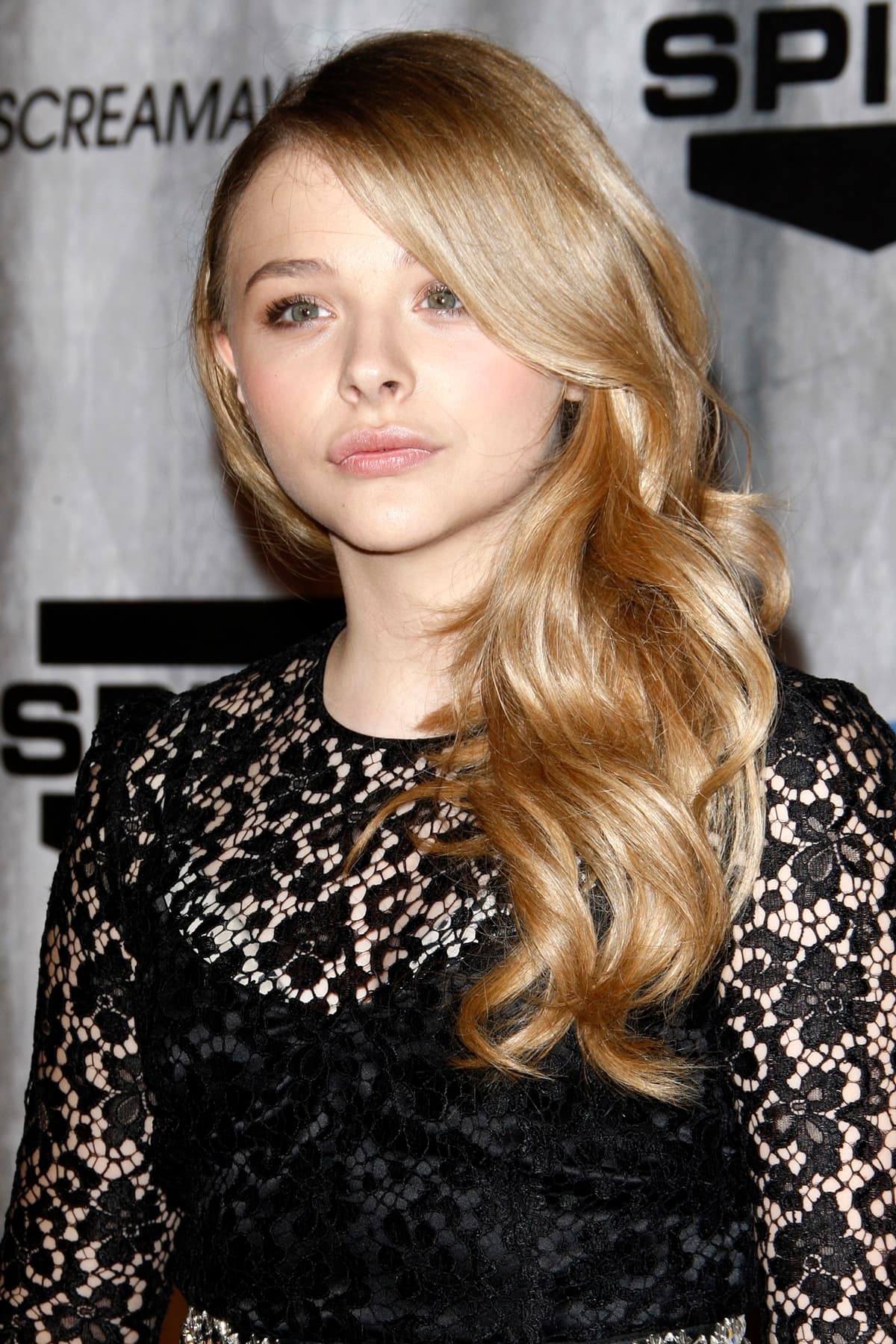Chloë Grace Moretz, in a Dolce & Gabbana dress, picked up the award for Best Horror Actress for her work in the romantic horror film Let Me In at the Scream Awards 2011