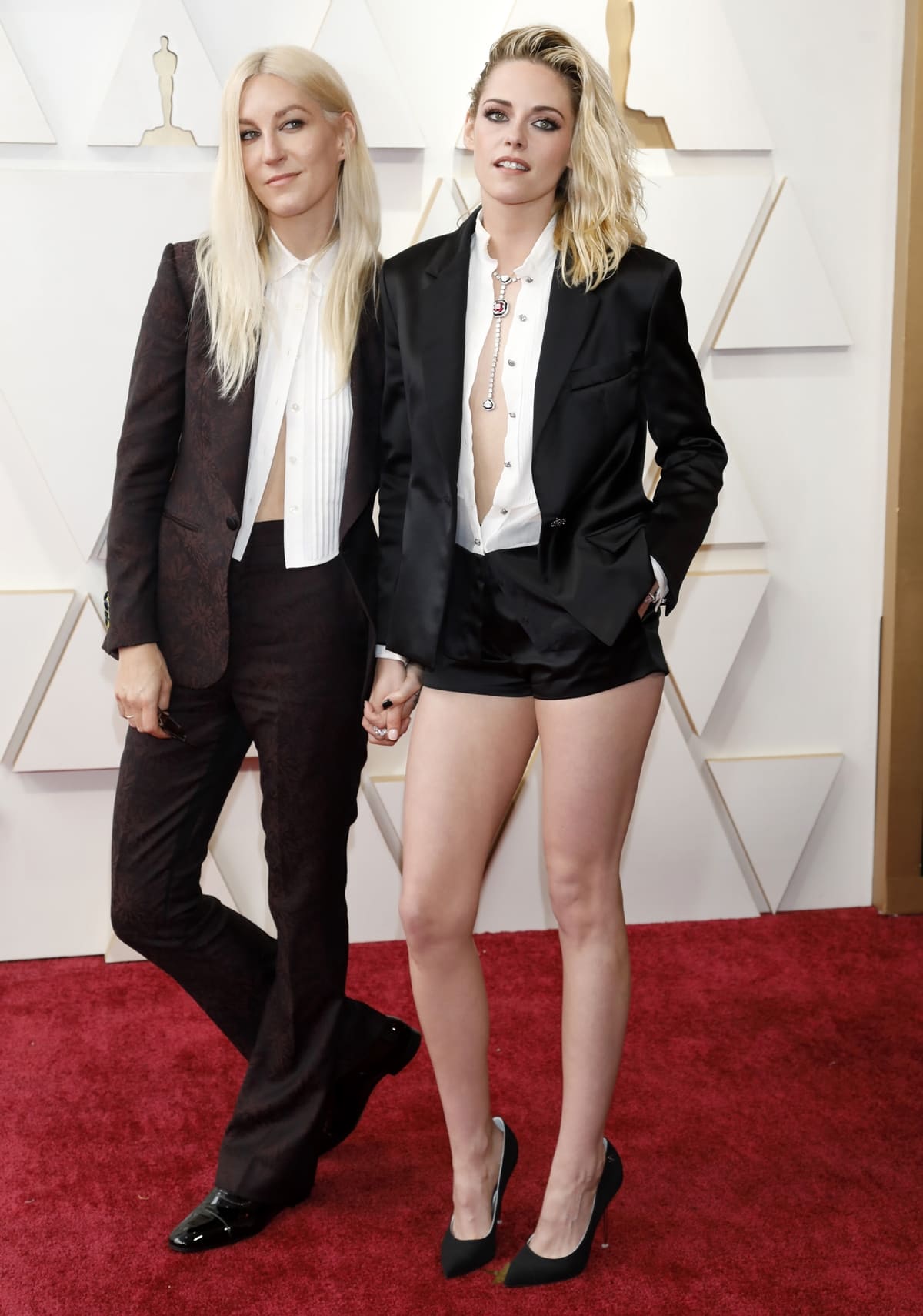 Dylan Meyer in a Damari suit and Kristen Stewart in Chanel at the 94th Annual Academy Awards at Hollywood
