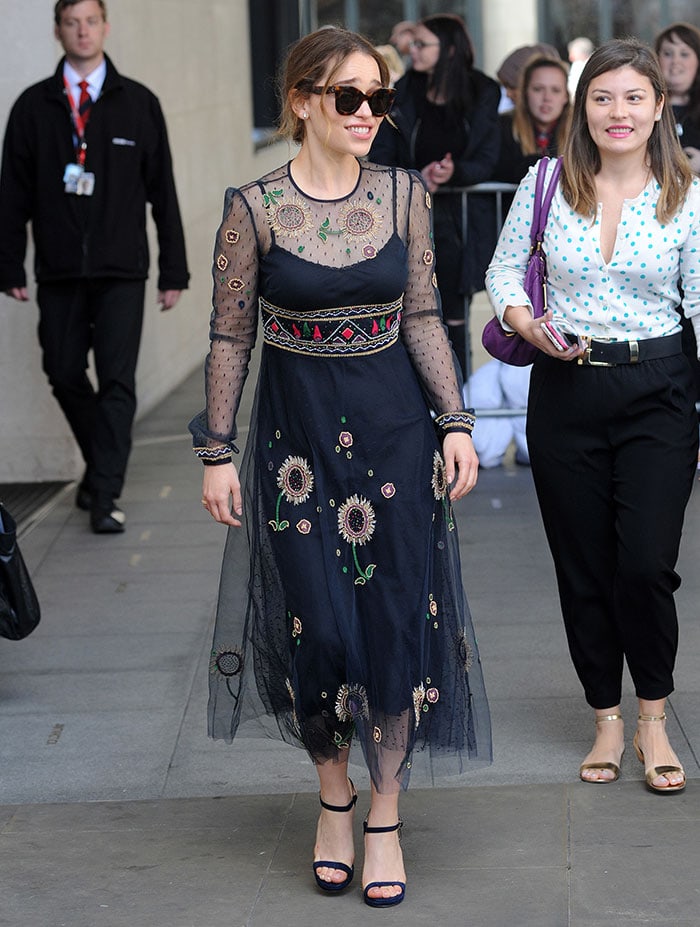 Emilia Clarke wears a dramatic black lace Valentino dress while promoting her upcoming movie 'Me Before You'