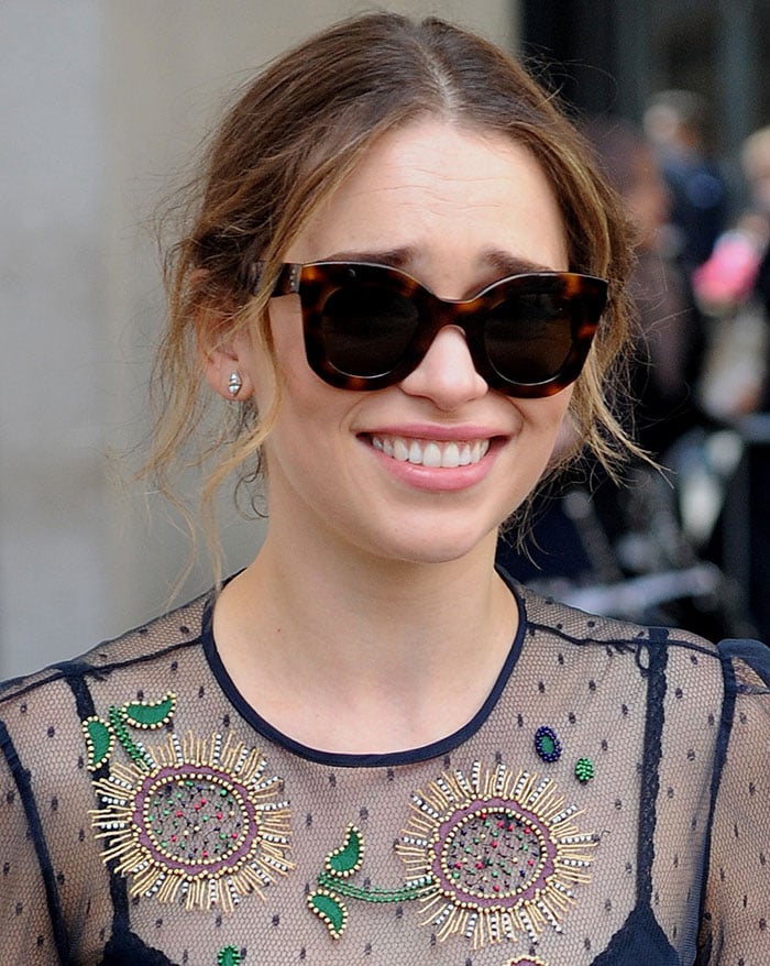 Emilia Clarke sweeps her hair back into a low bun for her "Me Before You" promotional events