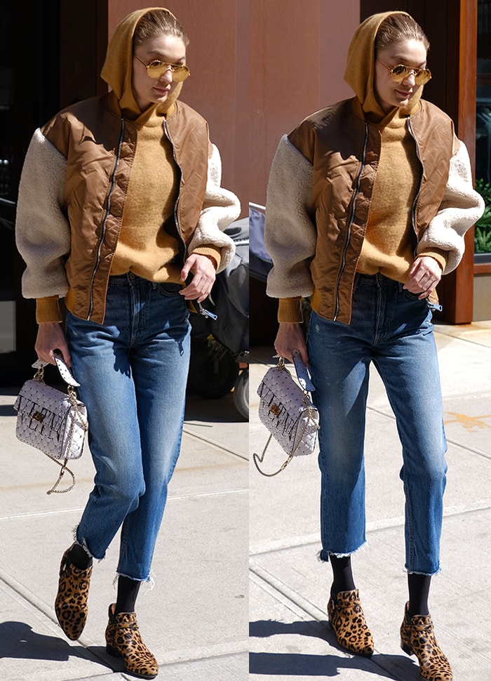 Gigi Hadid bundles up in a sweater, jacket, cropped jeans, and leopard booties