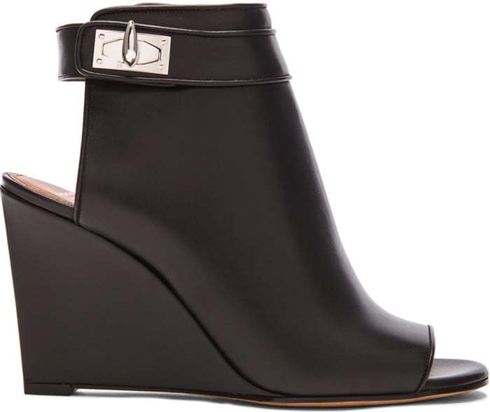 Open toe wedge bootie with cutout heel and ankle strap featuring shark tooth turn-lock