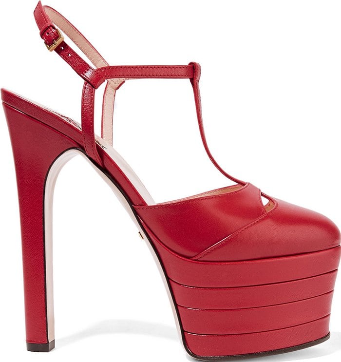 Red leather Gucci Angel platform pumps with round toes, covered heels, and buckle closure at ankles