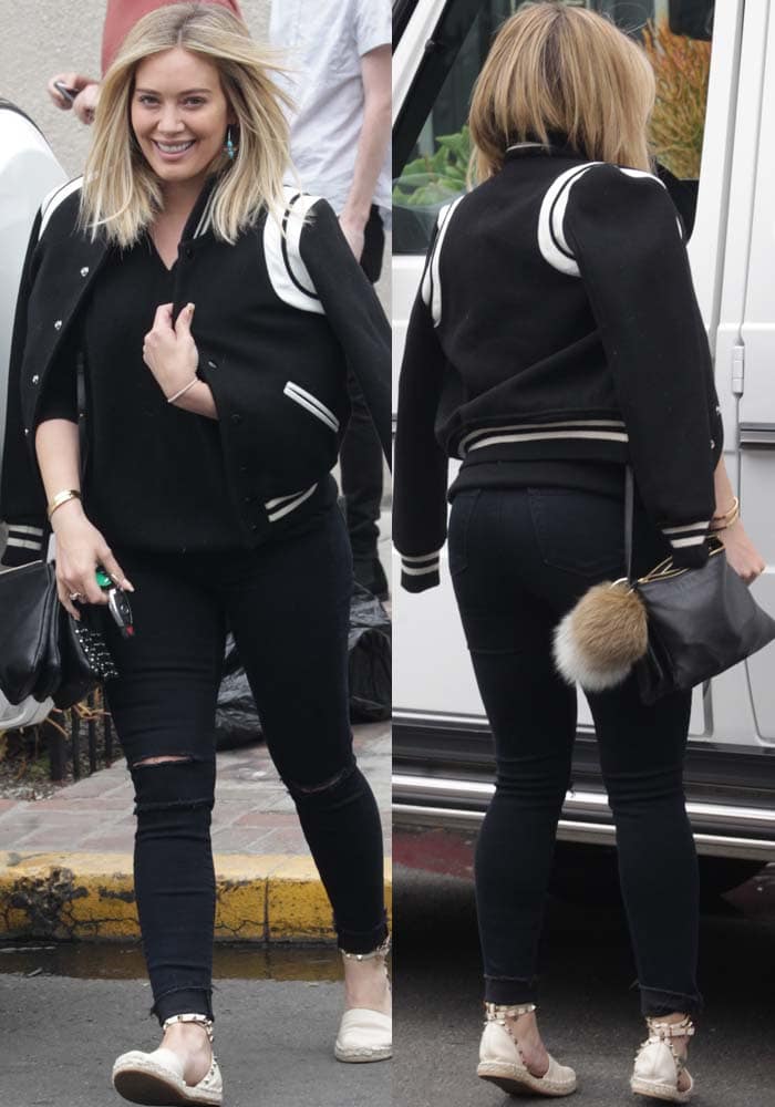 Hilary Duff steps out in effortless style, pairing a Saint Laurent jacket with ripped J Brand jeans, a black Equipment sweater, and Valentino 'Rockstud' espadrilles