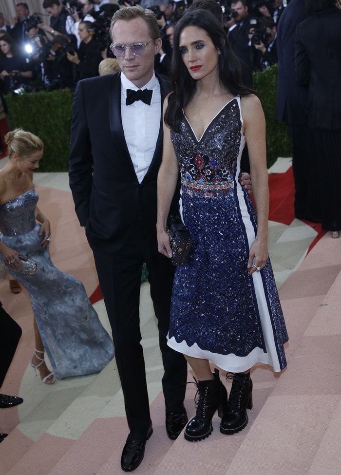 Jennifer Connelly and Paul Bettany pose for photos on the stairs at the Met Gala