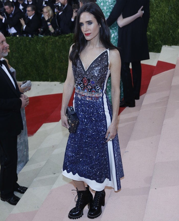 Jennifer Connelly styles her sequin-and-leather dress with chunky heeled lug-sole boots, all from Louis Vuitton