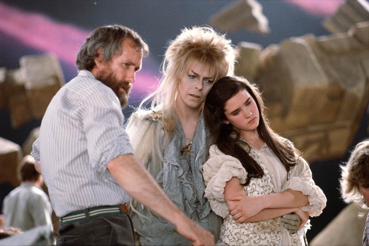Director Jim Henson, David Bowie, and Jennifer Connelly on the set of the 1986 musical fantasy film Labyrinth
