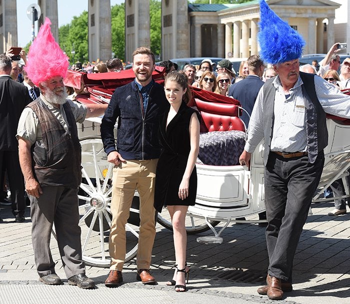 Justin Timberlake and Anna Kendrick pose with human "Trolls" dolls to promote their new animated movie