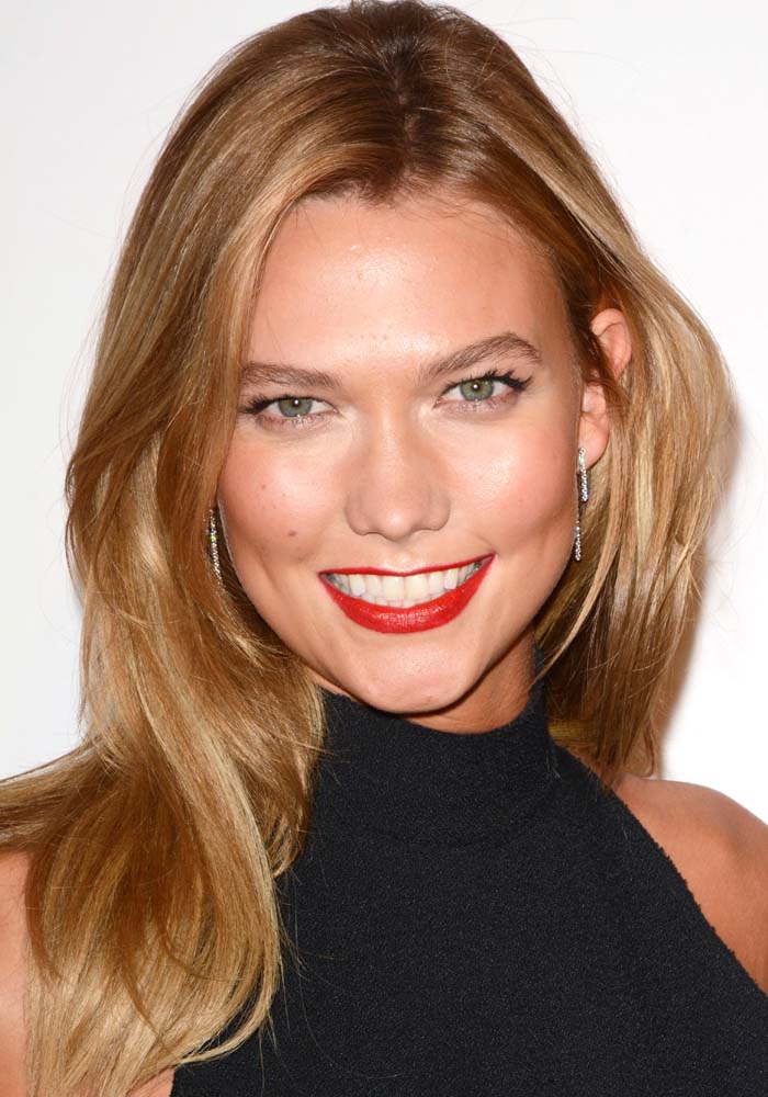 Karlie Kloss wears her blonde hair down as she attends a Swarovski event