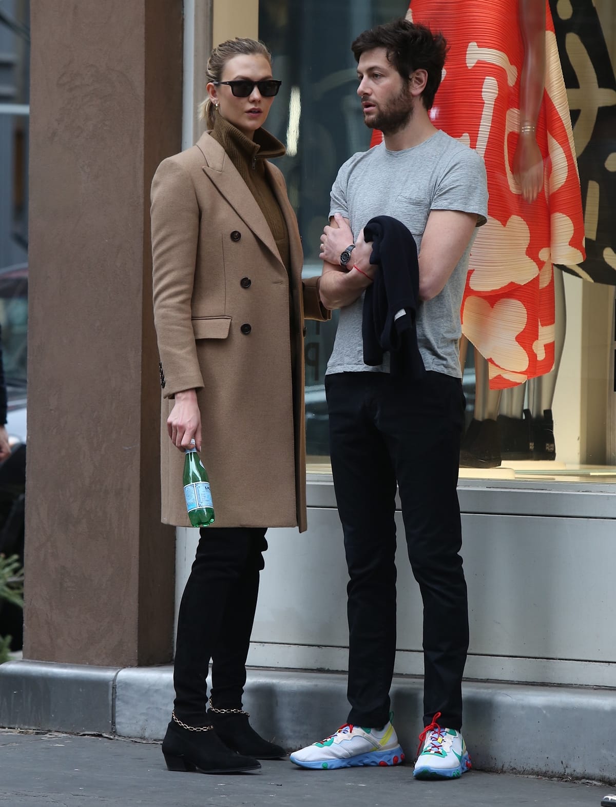 Wearing a Burberry double-breasted extra-long wool cashmere coat and Stella Luna over-the-knee boots, Karlie Kloss looks shorter than her husband Joshua Kushner