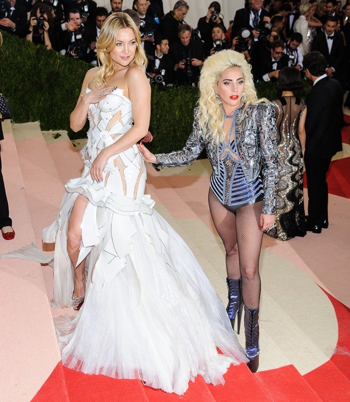 Kate Hudson and Lady Gaga show off their "Manus x Machina" ensembles on the Met Gala steps