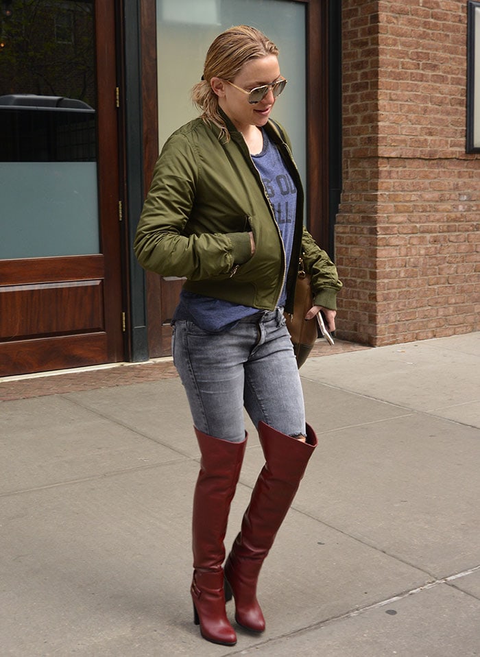 Makeup-Free Kate Hudson wearing an army green jacket while out in Manhattan