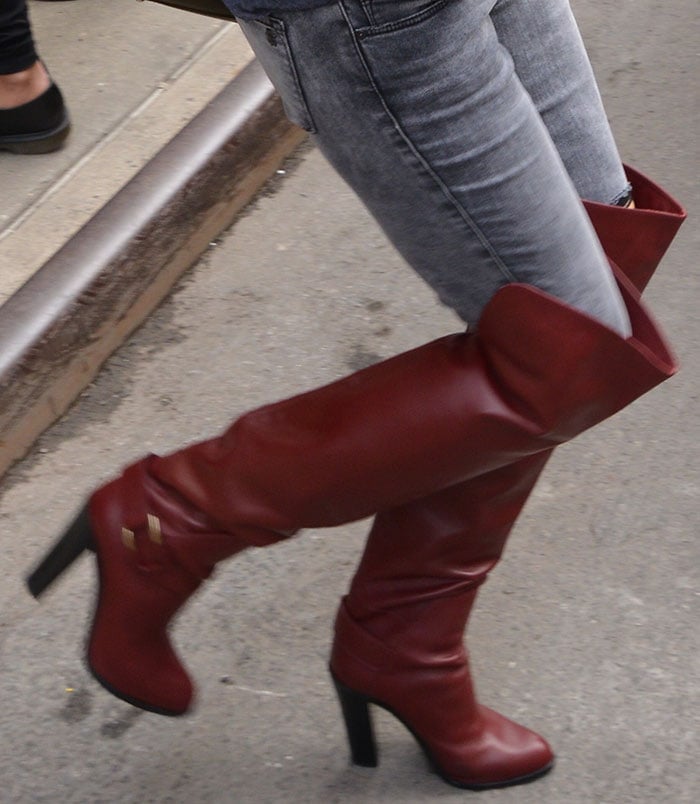 Kate Hudson in oxblood leather thigh-high boots
