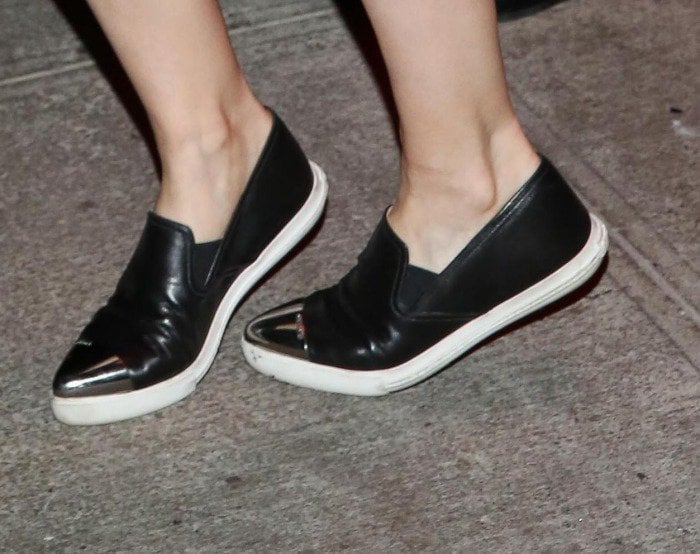 Kate Mara's feet in black Miu Miu slip-on sneakers