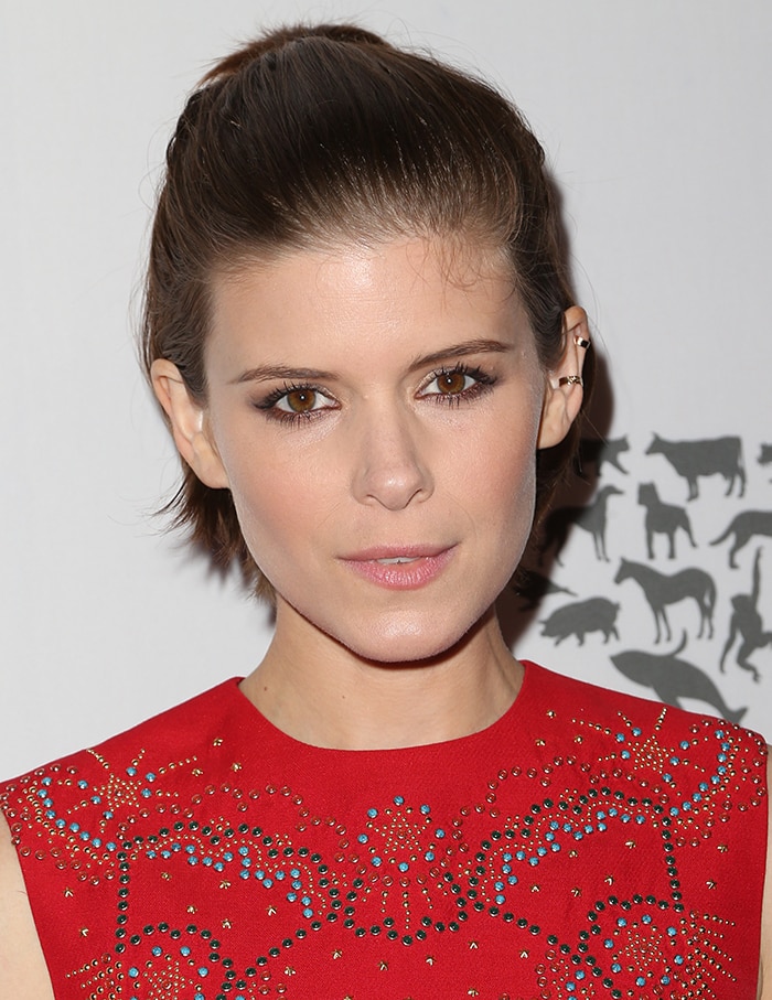 Kate Mara's auburn tresses were swept back and worn in a half-up