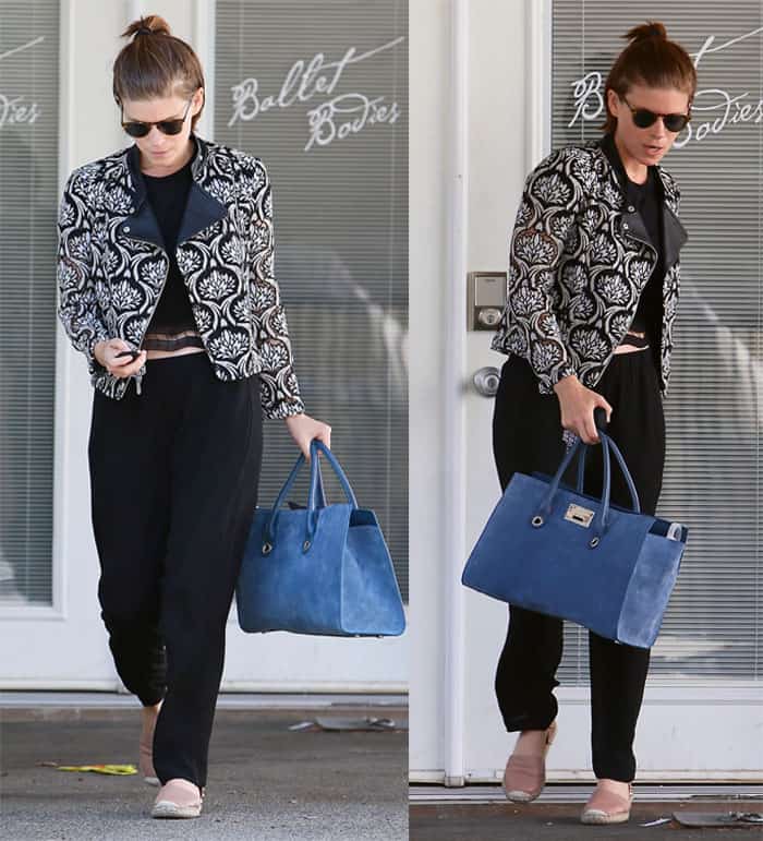 Kate Mara leaving Ballet Bodies in West Hollywood on May 26, 2016, wearing a  Yigal Azrouël embroidered lace moto jacket, black sweatpants, a cropped top, and carrying a Jimmy Choo Riley tote bag
