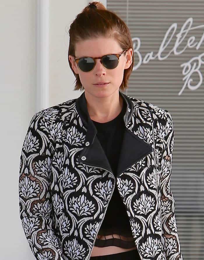 Kate Mara sports a sleek hairstyle, trendy round sunglasses, and minimal makeup, completing her effortlessly chic look in West Hollywood on May 26, 2016