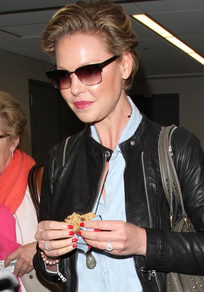 Katherine Heigl shows off her new short hairstyle as she arrives at Los Angeles International Airport