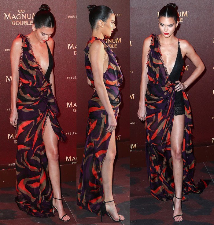 Kendall Jenner flaunts her model legs in a flowing Versace gown