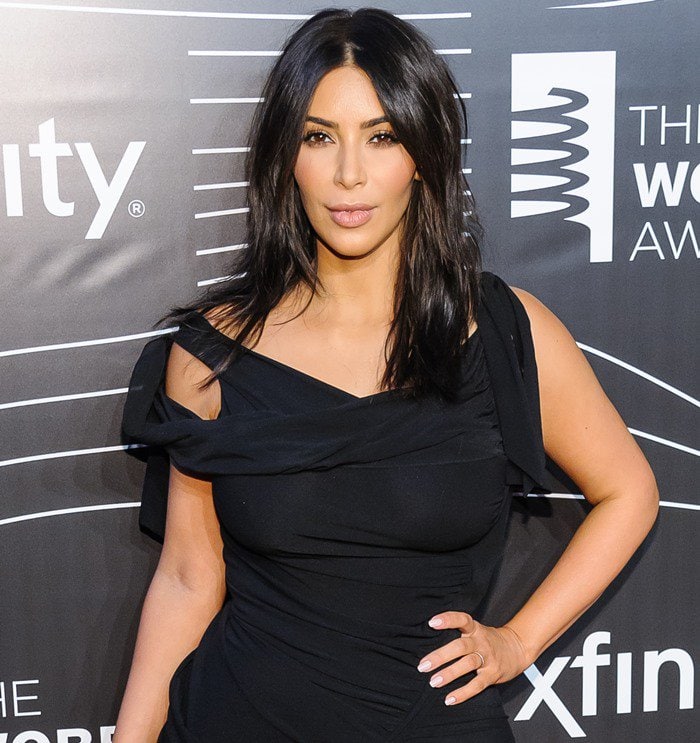 Kim Kardashian received the first ever Break the Internet Award and proudly posed for the cameras