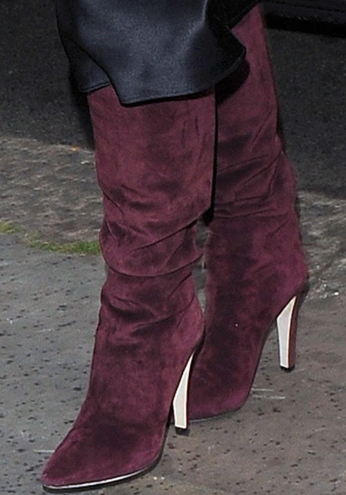 Kim Kardashian wears burgundy over-the-knee boots out in London