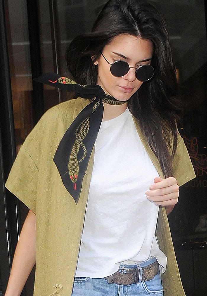 Kendall Jenner wears a Rockins Snakes super skinny scarf with a coat from Erika Cavallini