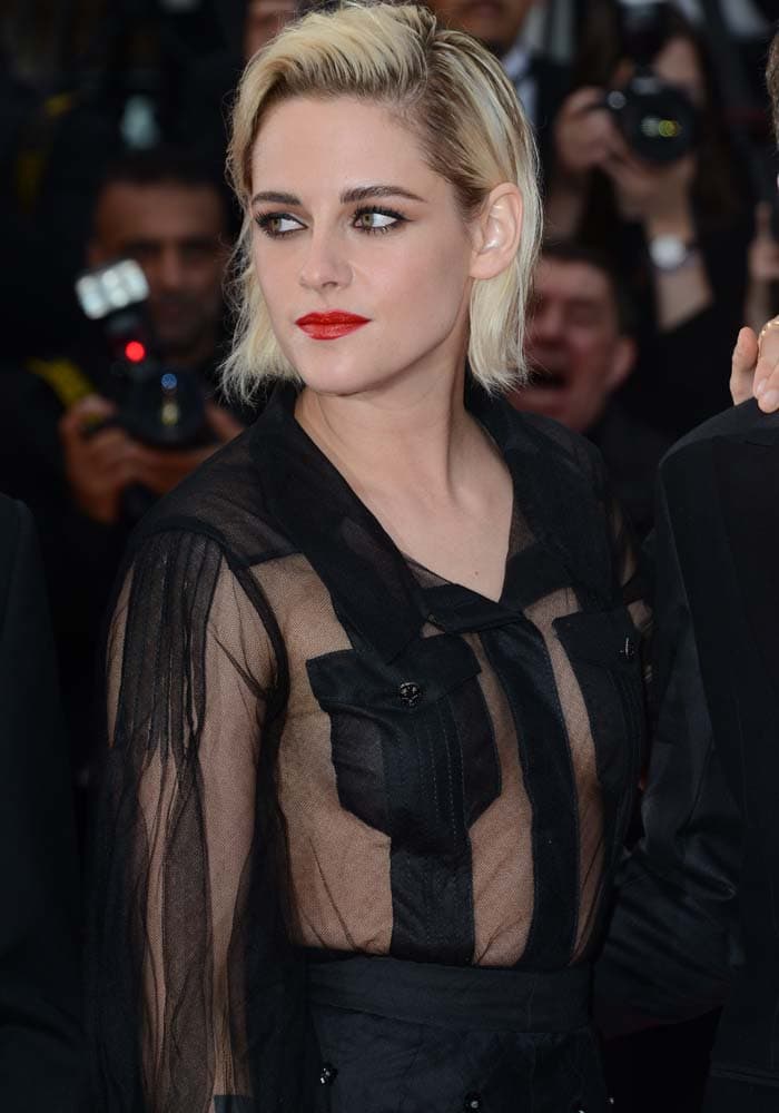 Kristen Stewart shows a lot of skin at the Cannes Film Festival in a sheer Chanel shirt