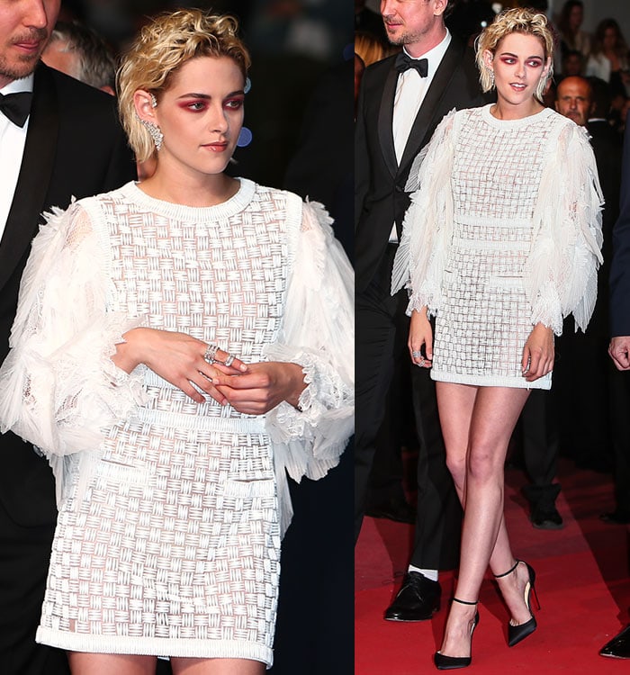 Kristen Stewart highlights her sexy thighs in a white knit embroidered mini dress