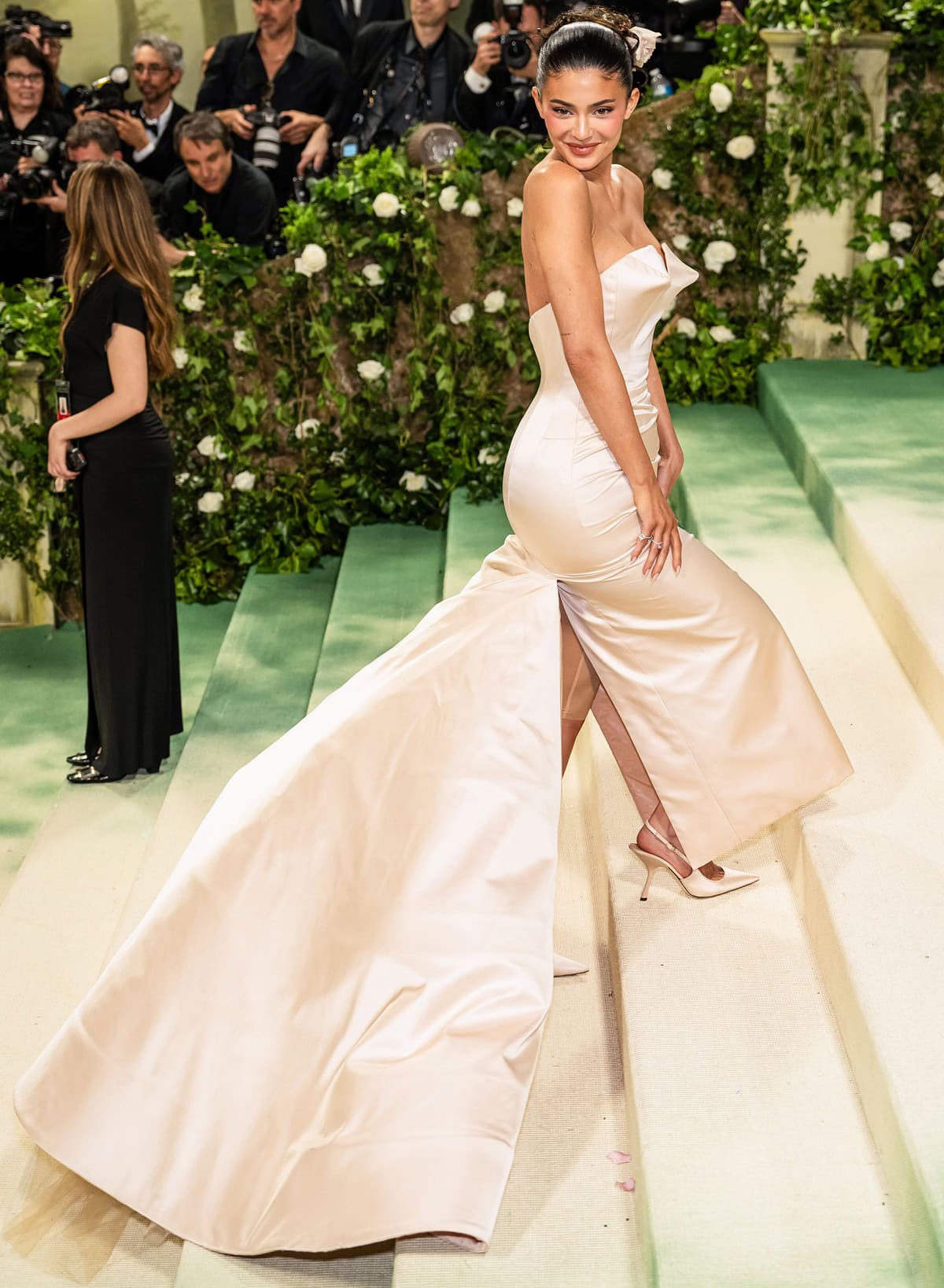 Kylie Jenner channels Old Hollywood glamour at the 2024 Met Gala in a custom Oscar de la Renta gown and sleek pointed-toe slingback pumps in a matching cream hue