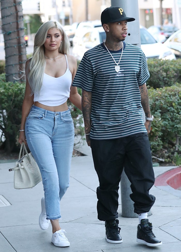 Kylie Jenner in casual glam: cropped jeans and white tank during Beverly Hills outing with Tyga