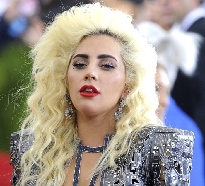 Lady Gaga wears her bleach blonde hair in a blown-out '80s style at the 2016 Met Gala