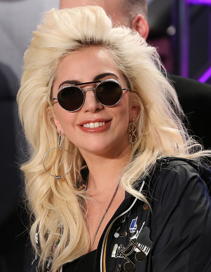 Lady Gaga styles her blonde hair into an '80s-style blowout at the launch of "Love Bravery"