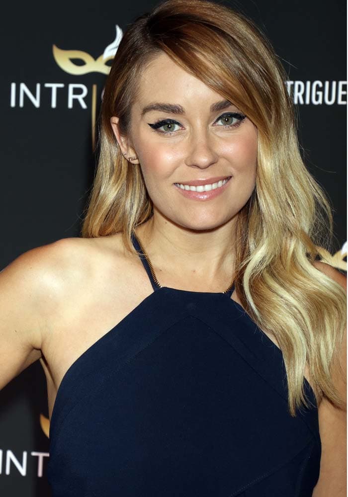 Lauren wears her blonde hair down at the grand opening of Intrigue Nightclub