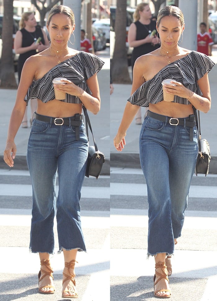 Leona Lewis looks chic in a one-shoulder crop top and flared cutoff jeans