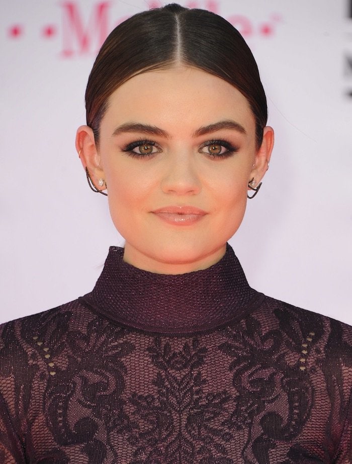 Lucy Hale center parts her dark hair for the 2016 Billboard Music Awards