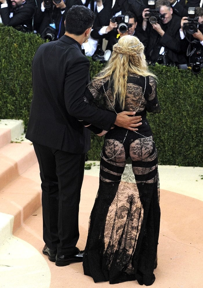 Madonna's Givenchy gown shows off her entire backside through lace paneling