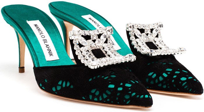 These Manolo Blahnik mules are crafted from green satin layered with black lace on the vamps with pointed toes
