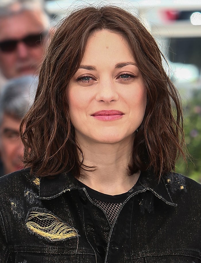 Marion Cotillard wears her hair down at the photo call for "Mal de Pierres" ("From the Land of the Moon") during the 69th Cannes Film Festival