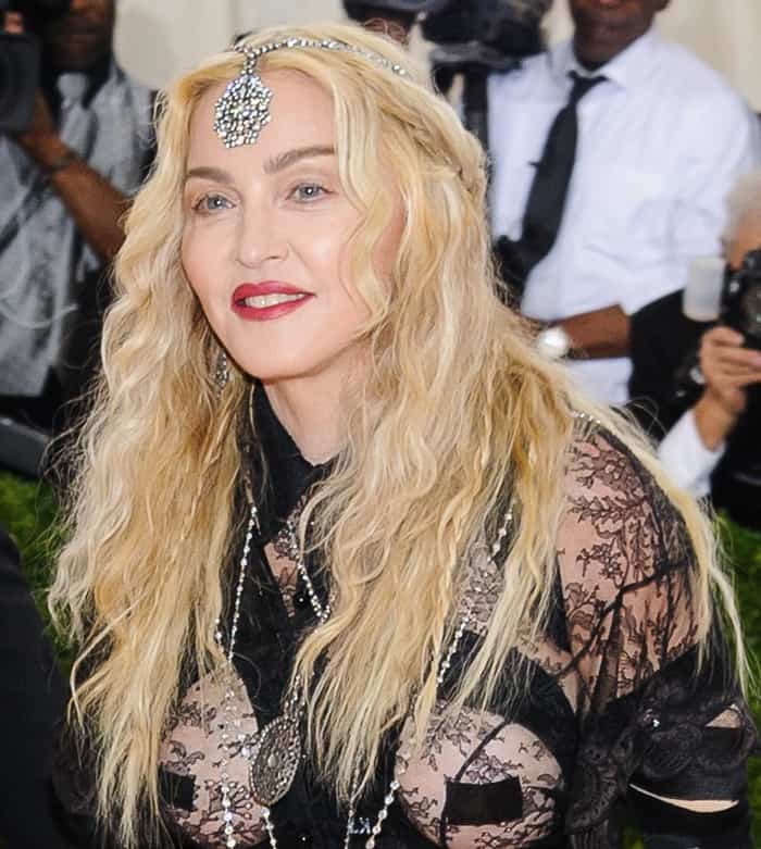 Madonna pairs her lace Givenchy ensemble with a striking Neil Lane diamond headpiece