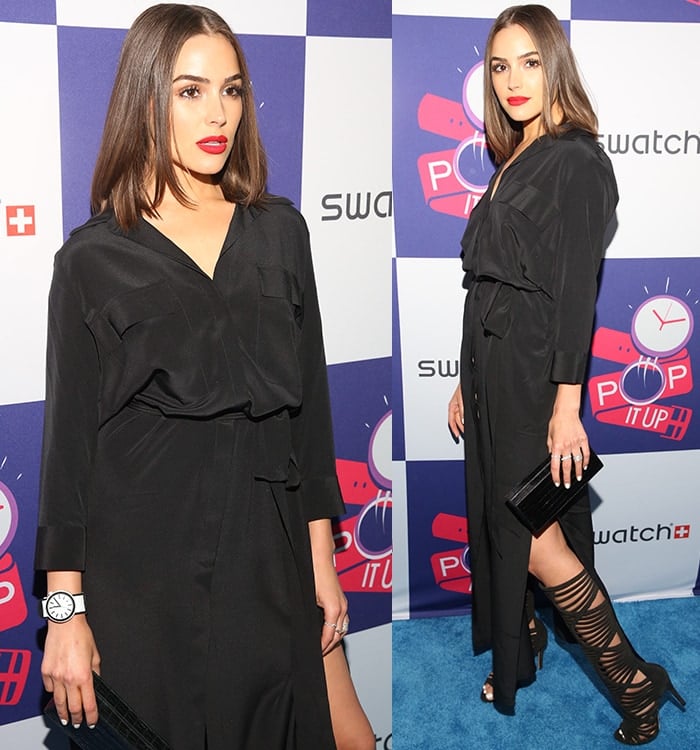 Olivia Culpo epitomizes elegance in a flowy L’Agence shirtdress, effortlessly chic at the Swatch event